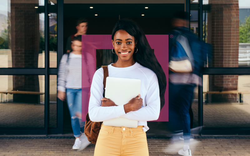 college-student-standing-on-campus-holding-textbooks-education-via-resp