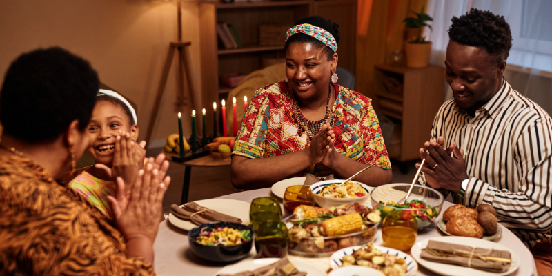 family-celebrating-kwanzaa-eating-dinner
